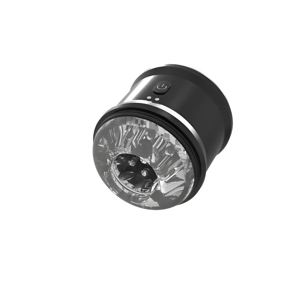 Black cylindrical Daytona Onyx dual open ended penis trainer with clear textured front panel and silver accent ring