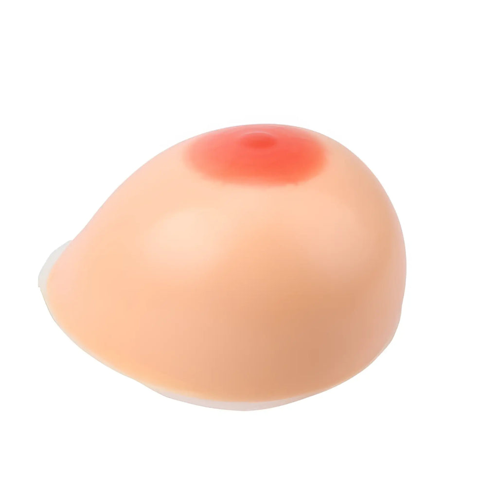 A realistic peach-colored silicone breast implant with a pinkish-red areola for Daytona self adhesive 800g g plus cup size