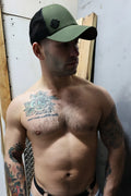 Olive green and black dirty trucker hat with a small embroidered logo on front for casual wear
