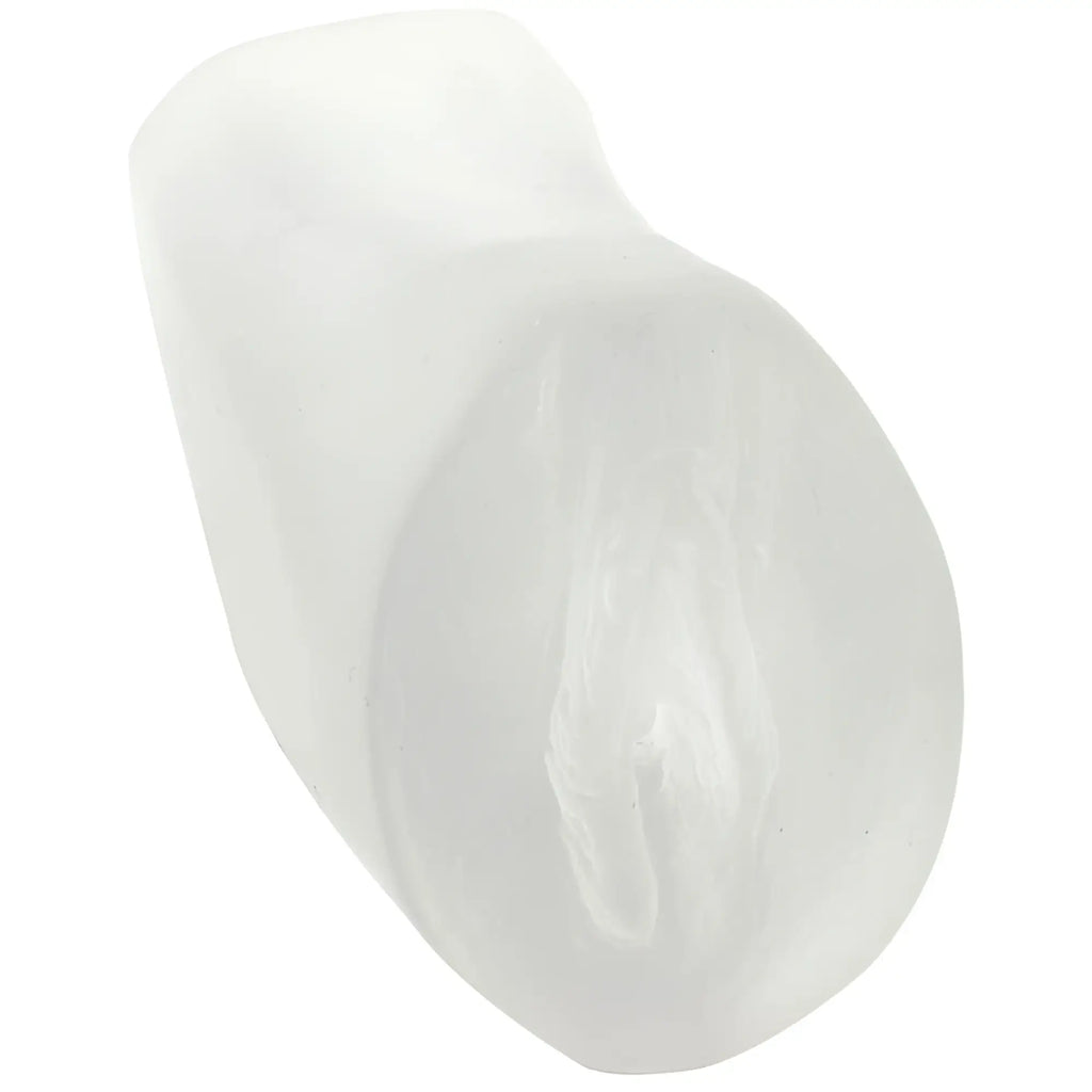 A translucent white silicone dental mold shaped like a human tooth from doc johnson palm pal ultraskyn pussy frosted clear