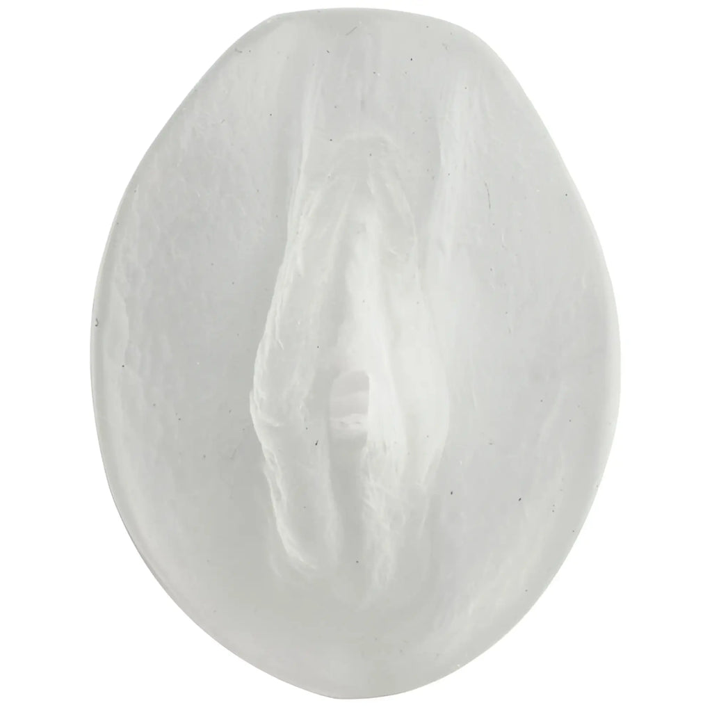 White oval-shaped soap with textured surface and subtle embossed design for doc johnson palm pal ultraskyn pussy frosted clear