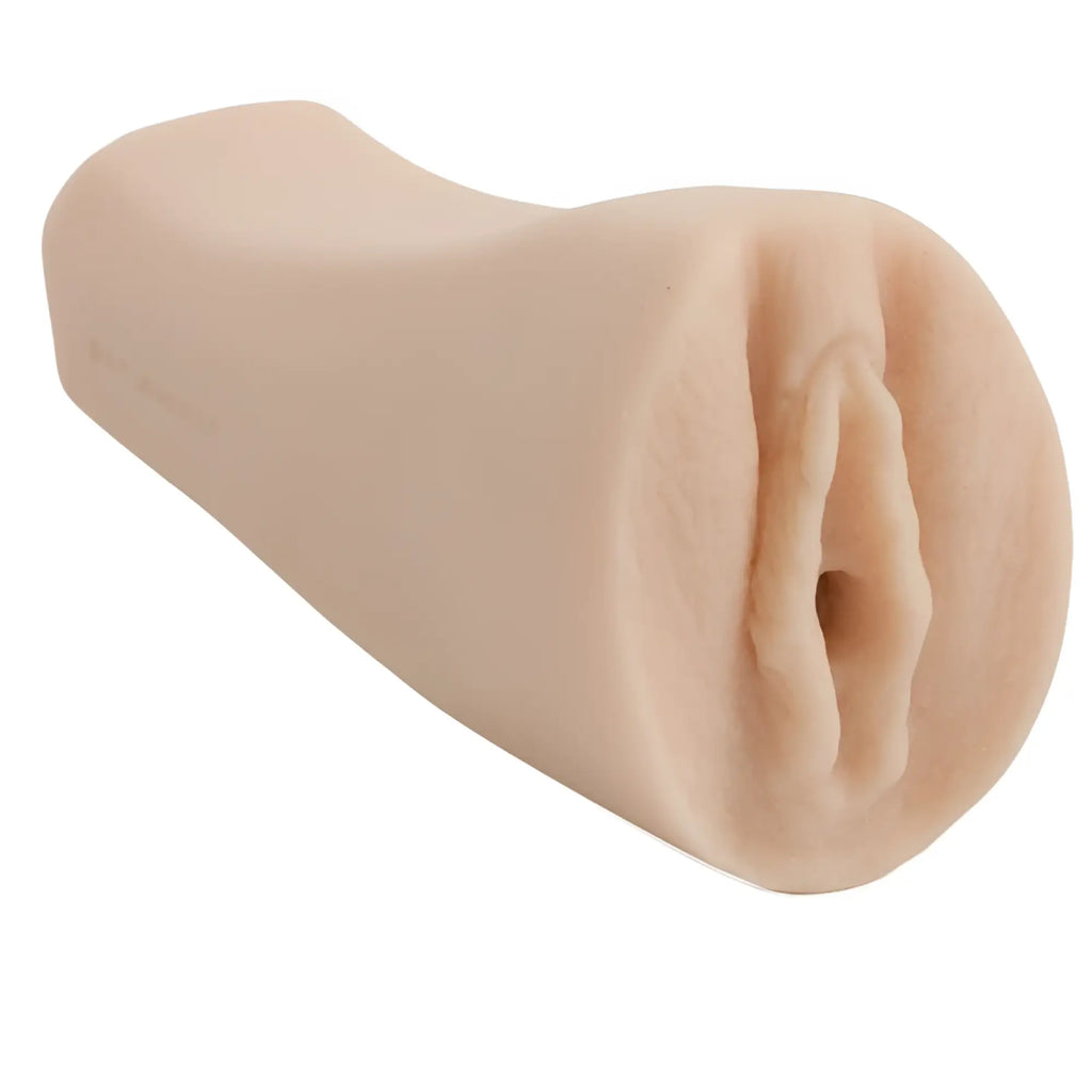 Beige silicone anal plug with textured realistic design from doc johnson palm pal ultraskyn pussy white product line
