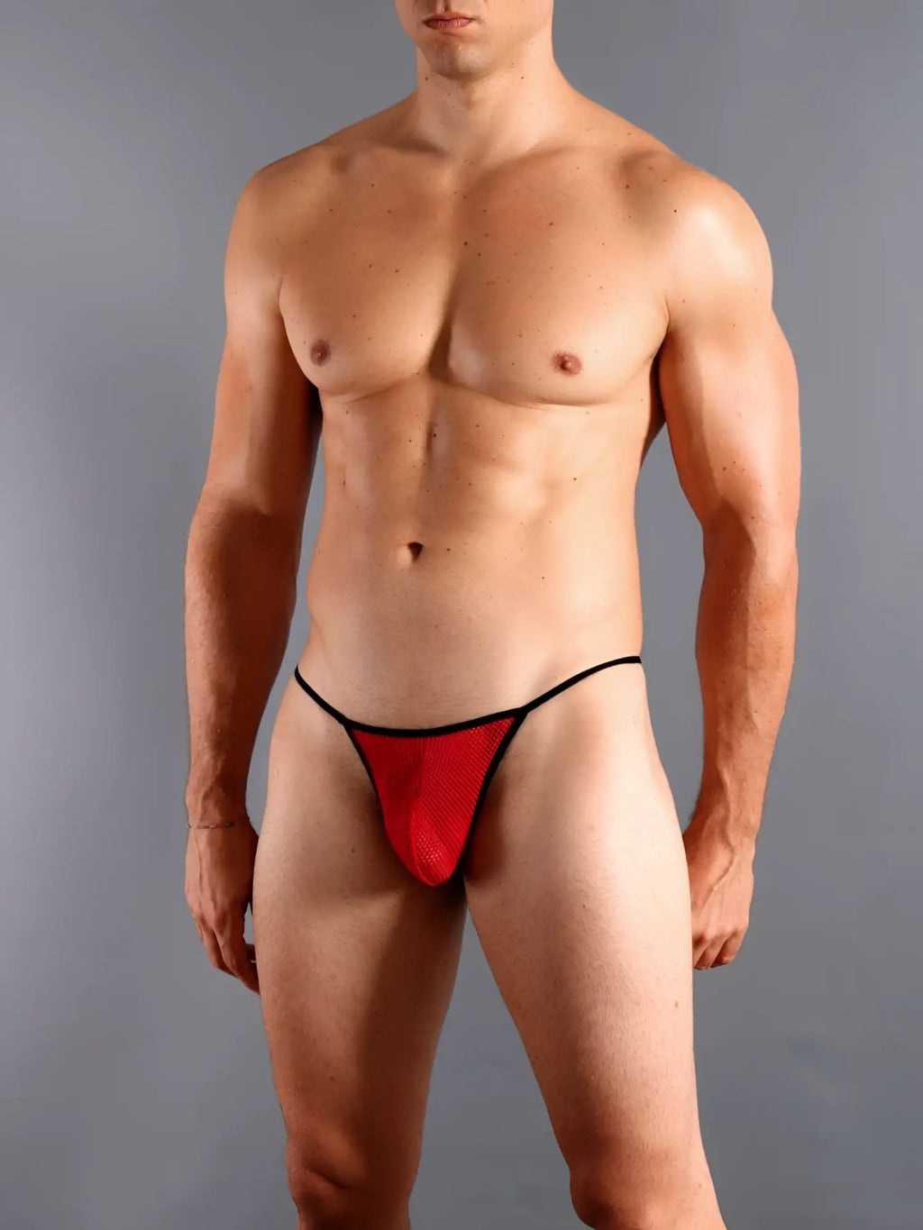 Red mesh g-string thong with black trim by doreanse in red showing delicate mesh material and slim design