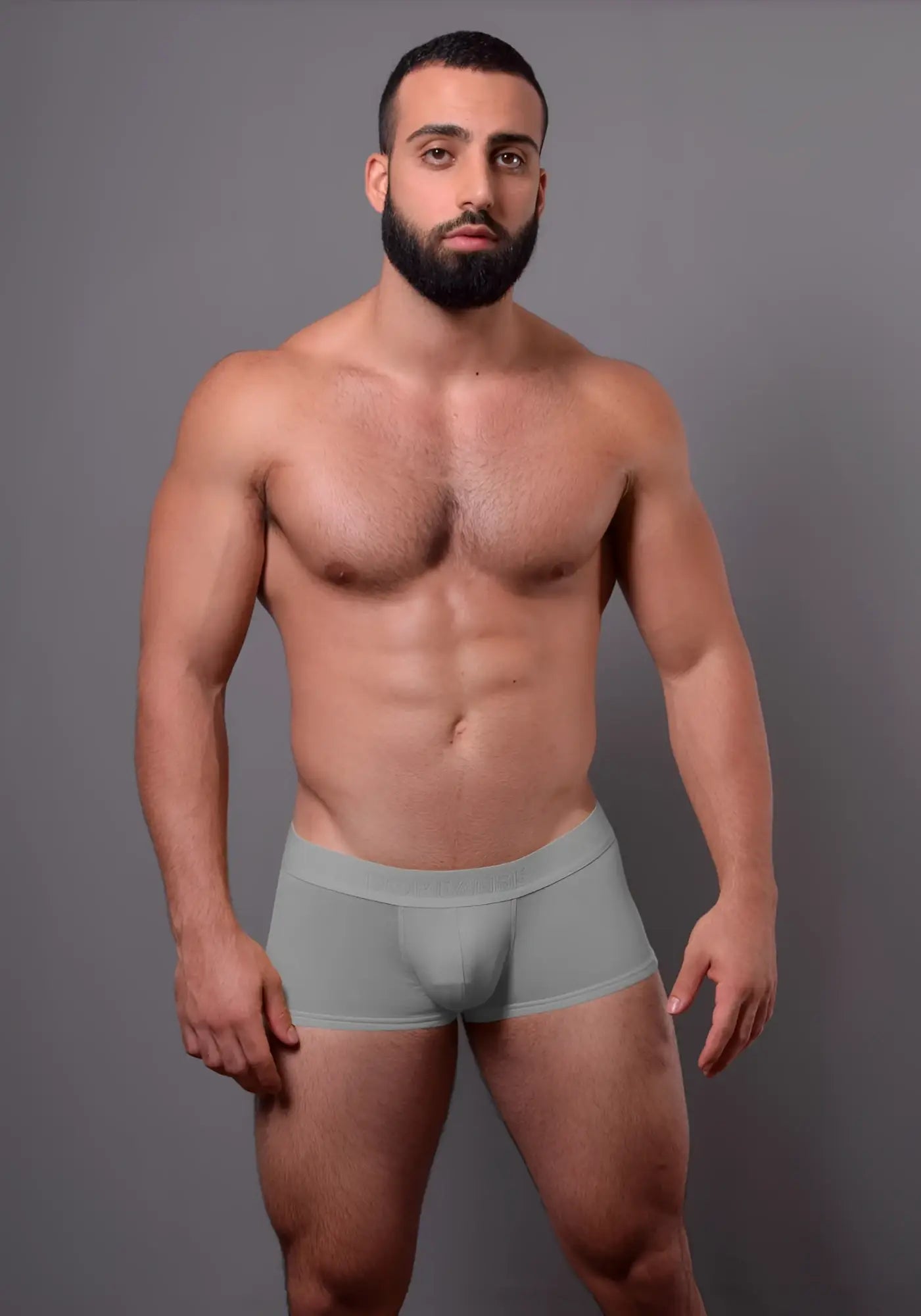A pair of light gray doreanse 1760-gry low-rise seamless men’s briefs with a smooth form-fitting design