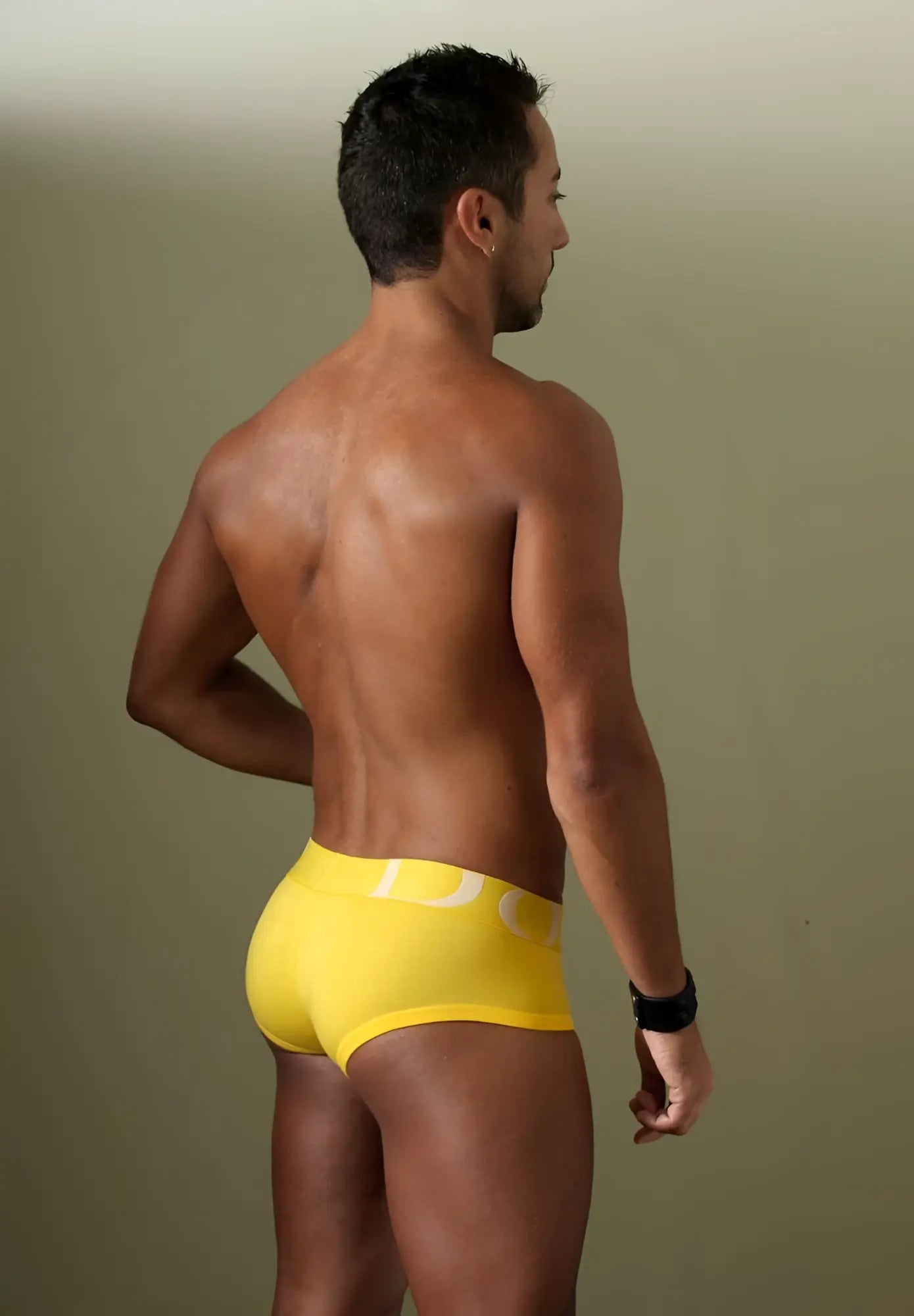Bright yellow doreanse 1779-ylw pouch mini trunk briefs with white logo on waistband made of soft fabric