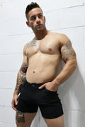 Black denim down low shorts with classic five-pocket design and button closure perfect for casual wear
