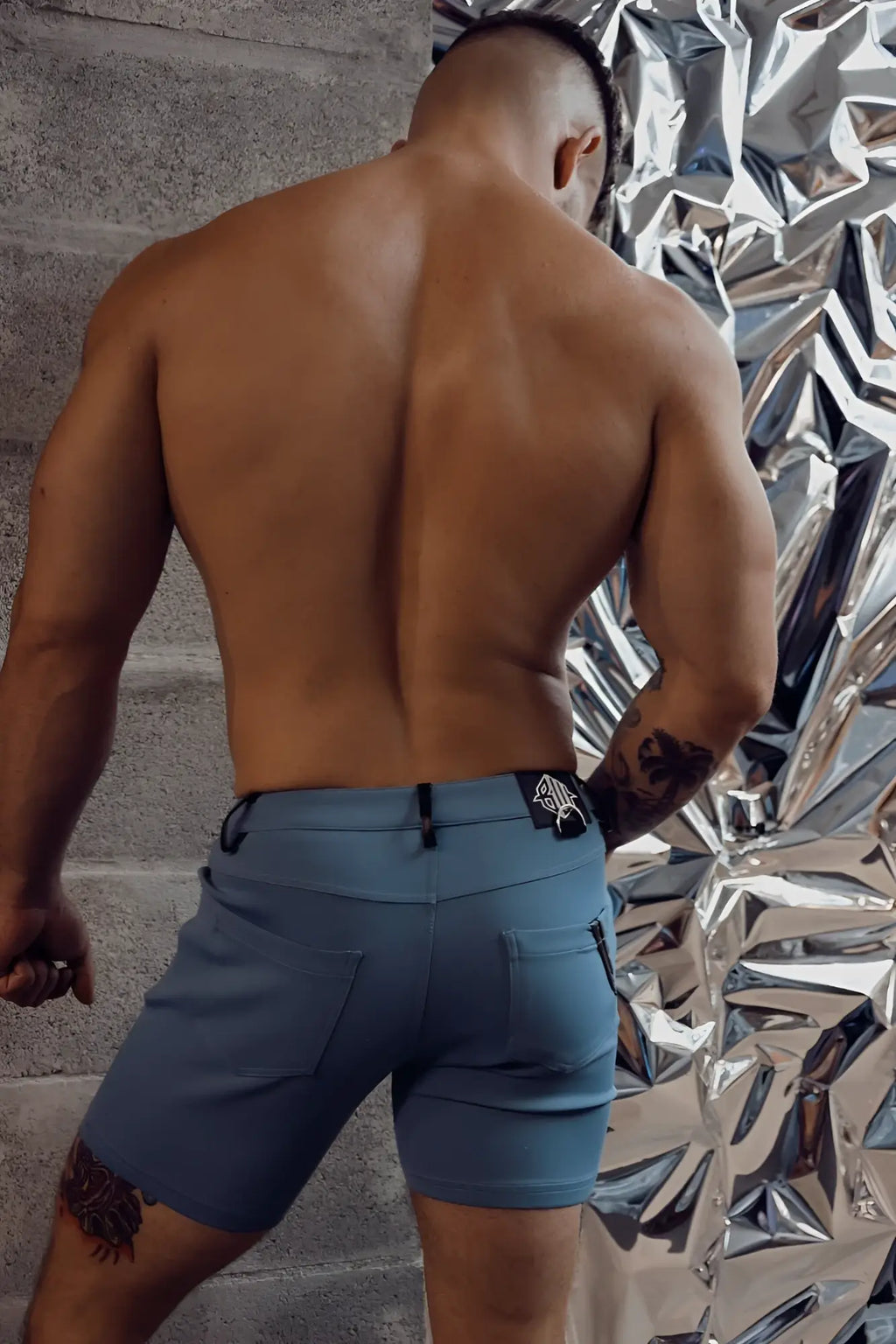Blue down low shorts in slate blue with sleek modern design and subtle stitching details for athletic use