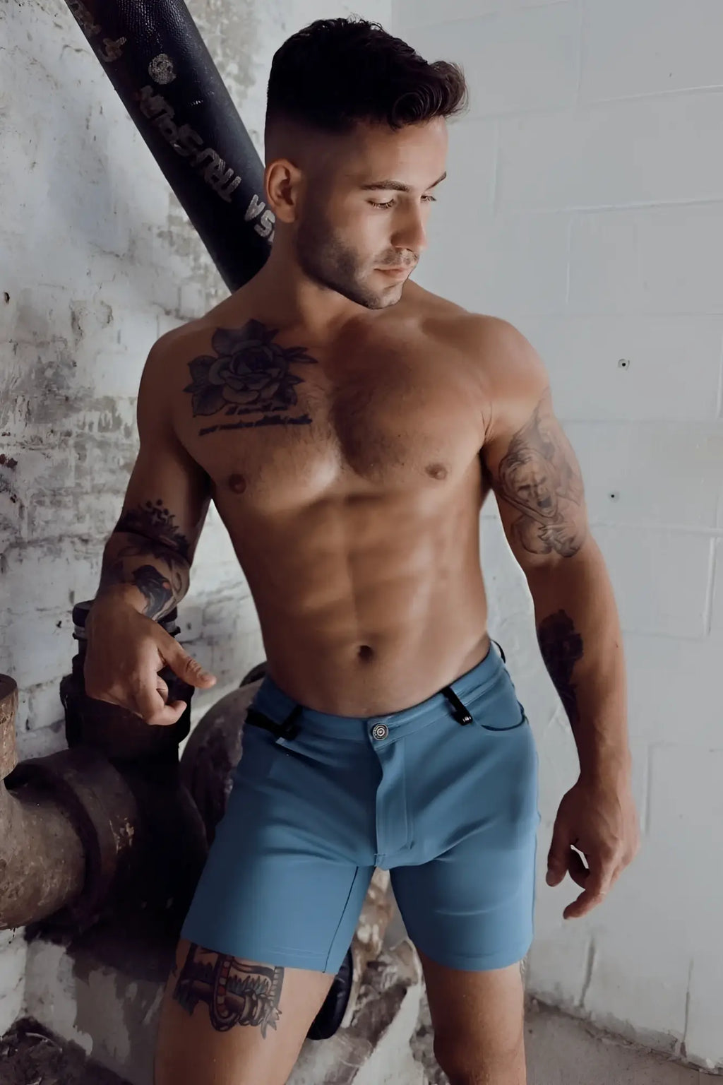 Blue denim down low shorts in slate blue with button closure and belt loops for casual wear