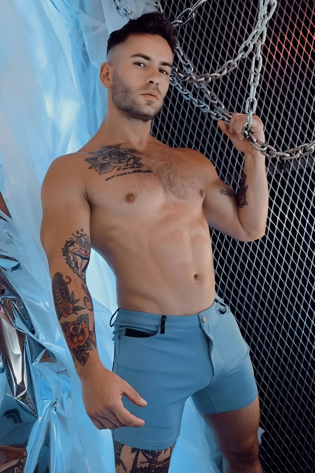 Light blue denim down low shorts with button closure and side pockets in slate blue color