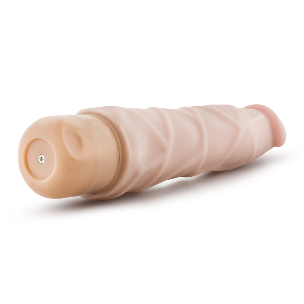 Beige silicone vibrating cock vibe with textured ribbed surface and rounded ends by dr skin