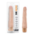 A peach-colored realistic-textured silicone vibrating cock ring from dr skin for enhanced pleasure and comfort