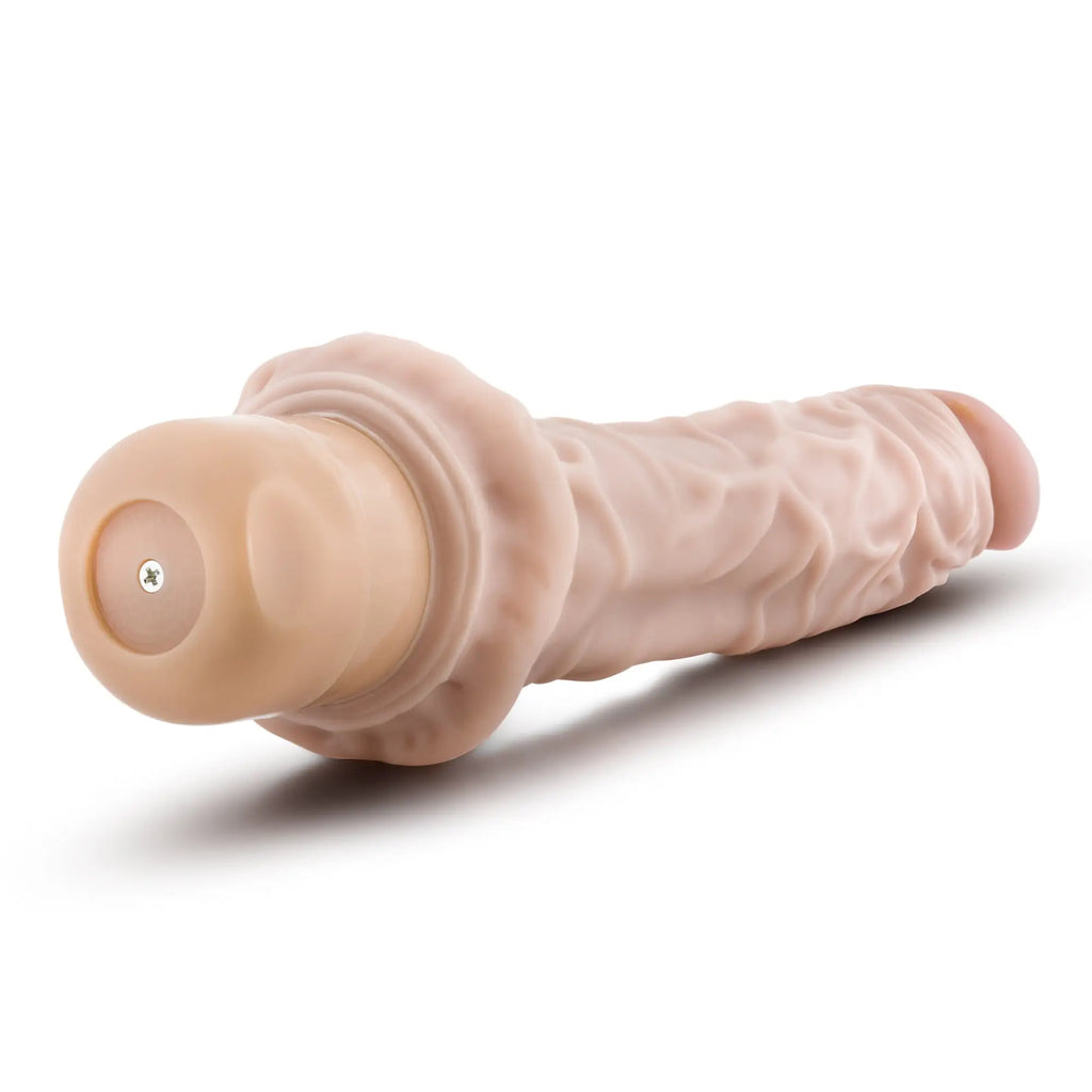 Beige silicone vibrating cock vibe with textured ridges and rounded head from dr skin measuring 8 9.75 inches