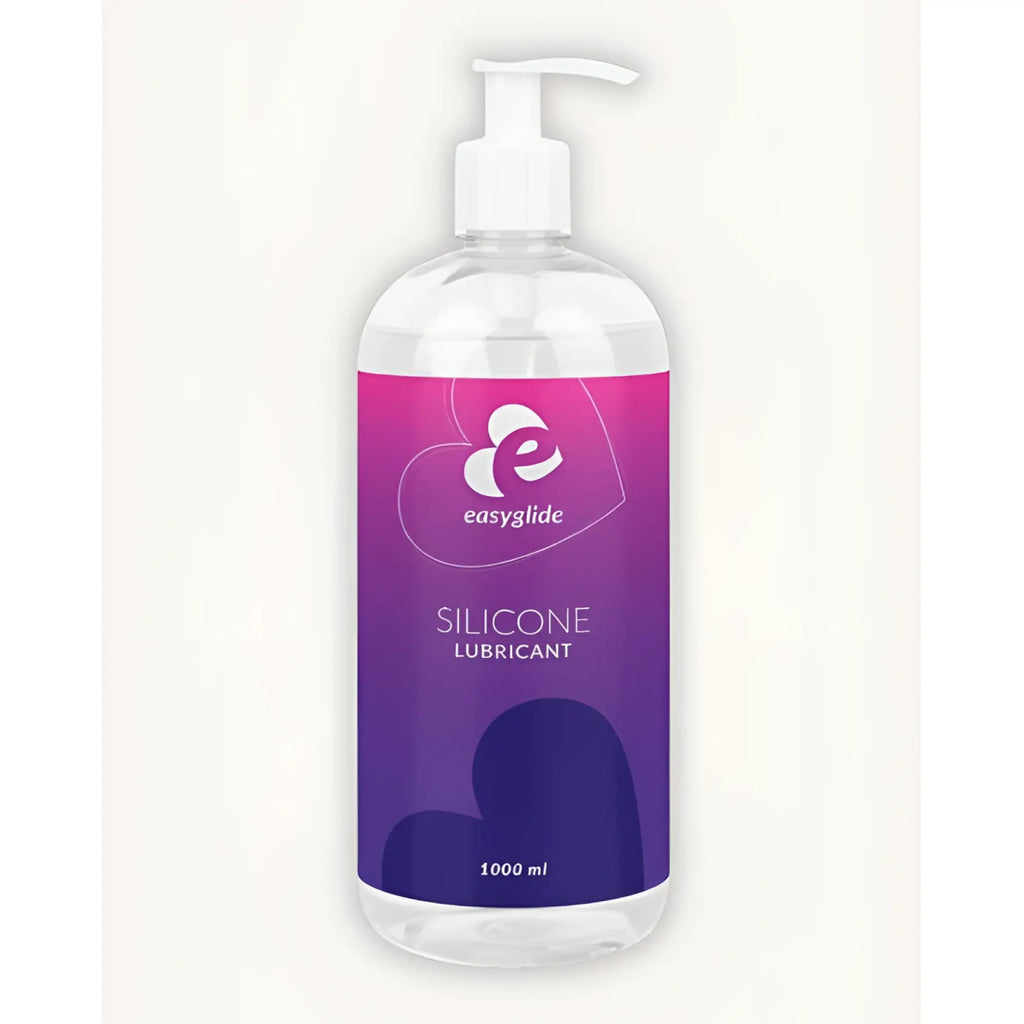 A clear plastic bottle with white pump containing easyglide silicone lubricant in purple and pink packaging 1kg