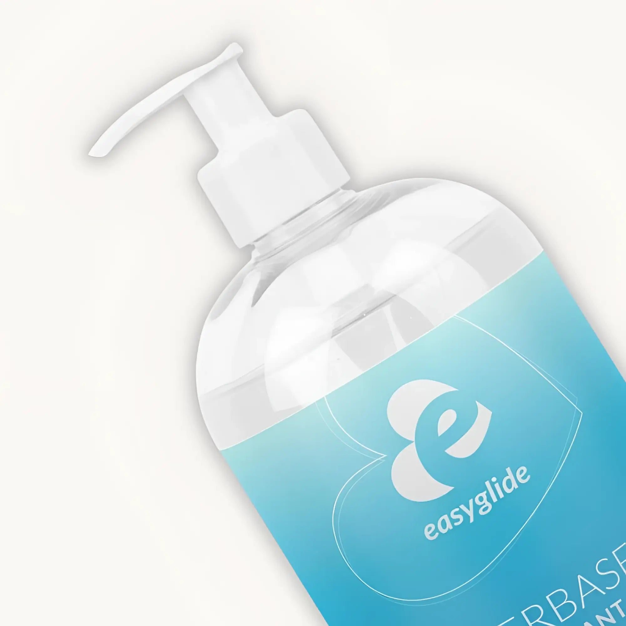 A clear plastic bottle with a white pump dispenser and a light blue easyglide label containing water based lubricant 1kg