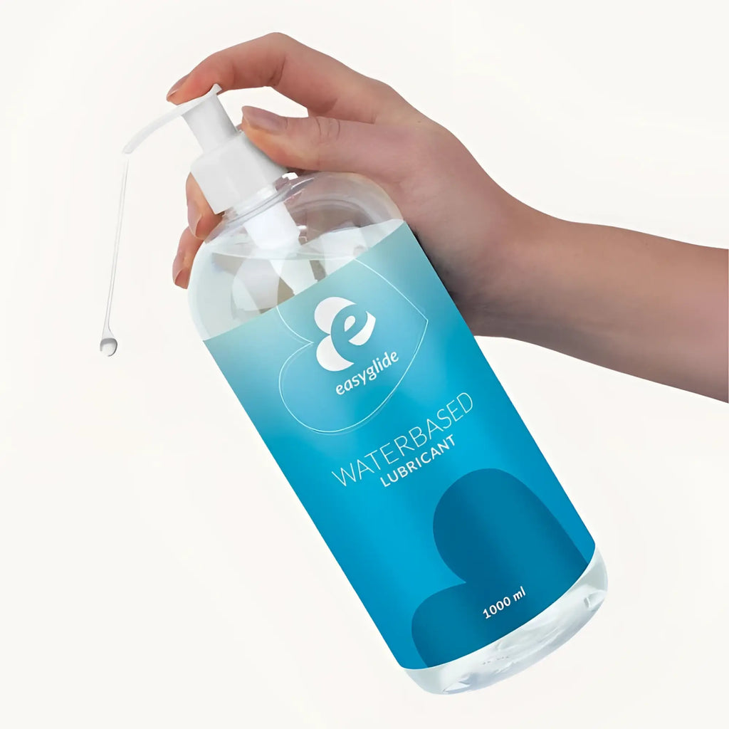 A clear plastic bottle with white pump dispenser labeled easyglide water based lubricant 1kg for smooth use