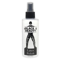 Elbow Grease Black Beauty latex polish spray bottle with clear body black cap and label showing figure in latex gear