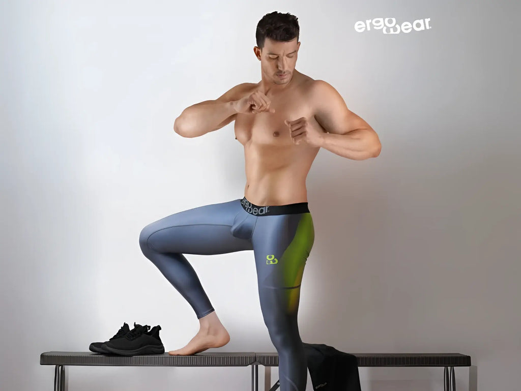 A pair of ergo wear ew1604 max se ergonomic men’s leggings in gradient blue and green with logo waistband