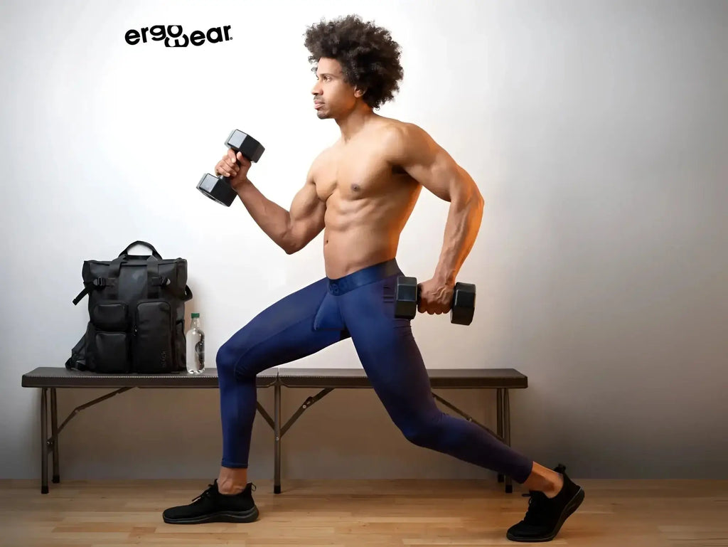 Black ergonomic dumbbells with matte finish and textured grip paired with ergoWear ew1782 max bold dark blue athletic pants