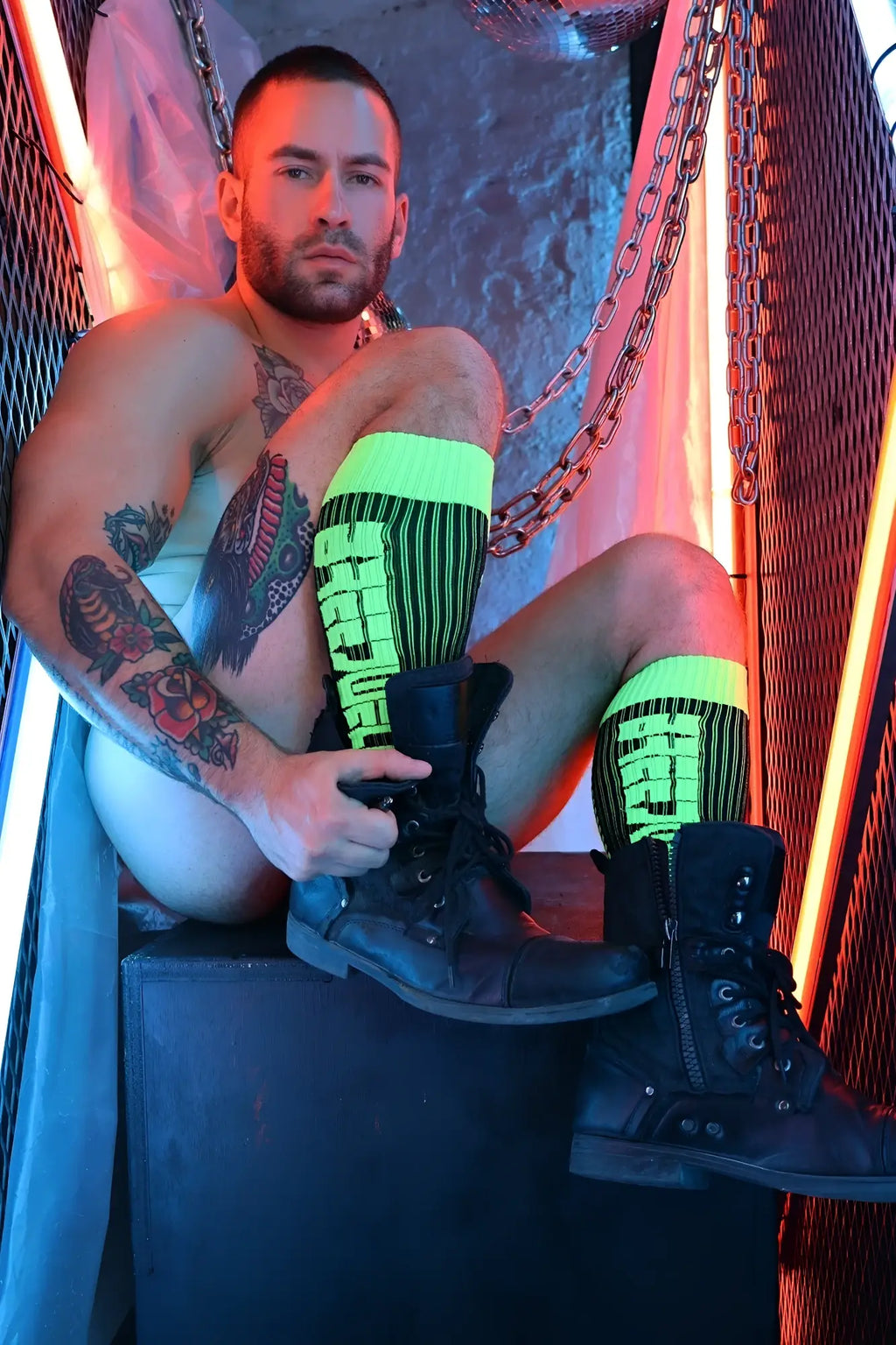 Black leather combat boots with laces and metal eyelets shown with eternity socks for durable comfort and style