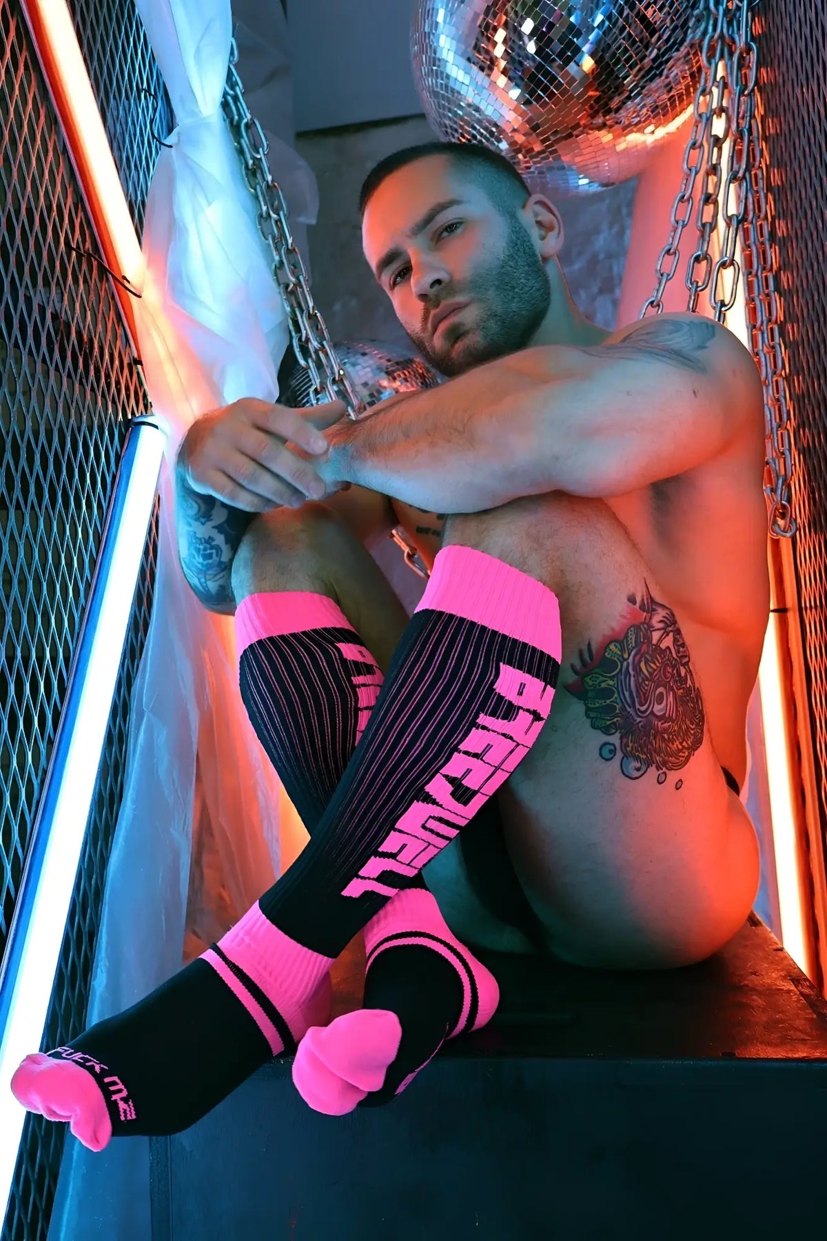 Black and neon pink knee-high eternity socks with bold glowing lettering perfect for stylish streetwear looks