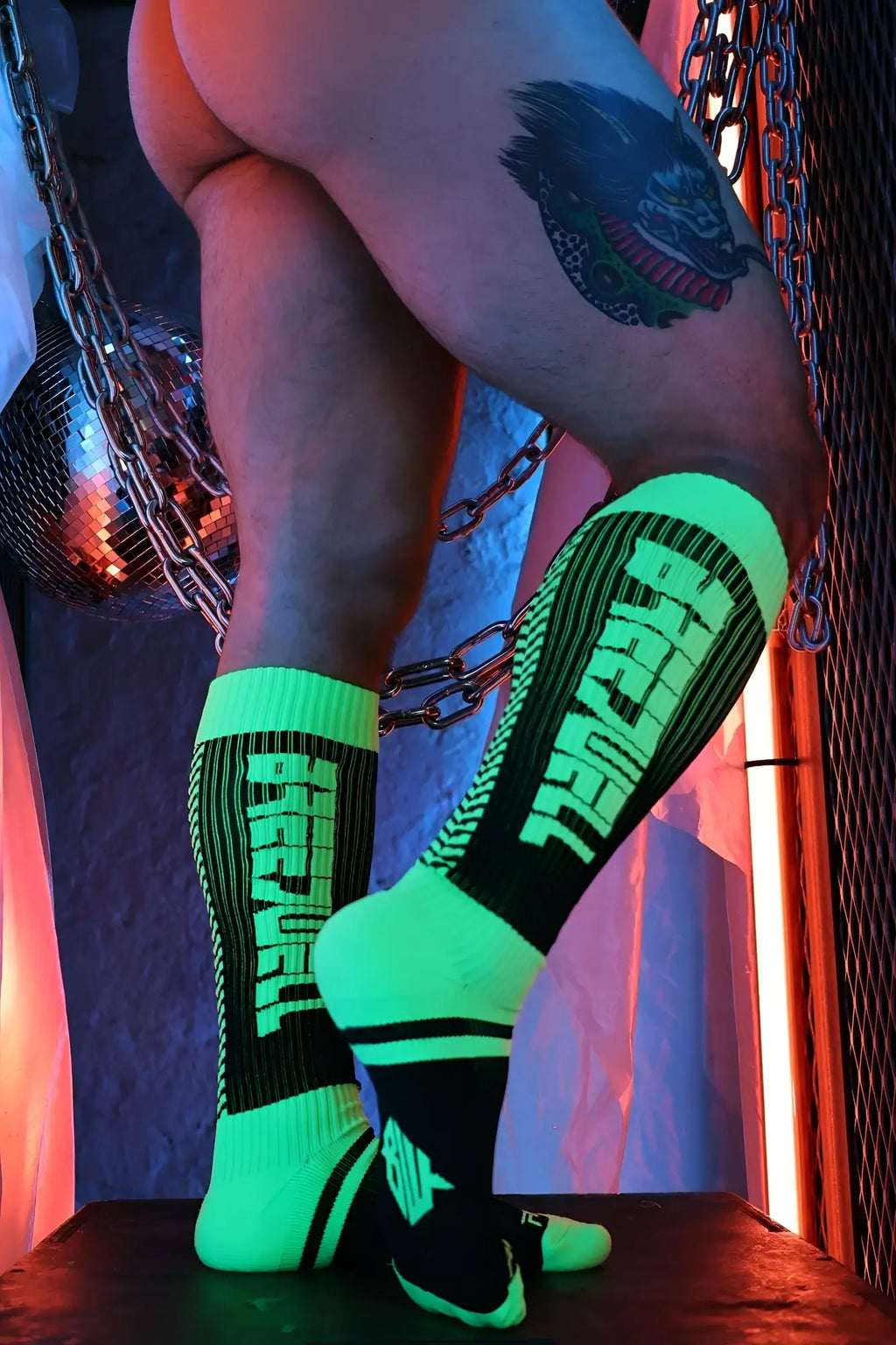 Eternity socks glow-in-the-dark neon green and black athletic socks with bold vertical lettering for sports use