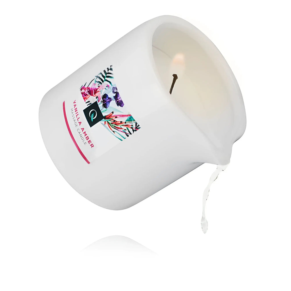 White ceramic exotiq massage candle with a lit single wick floral vanilla amber label 200g
