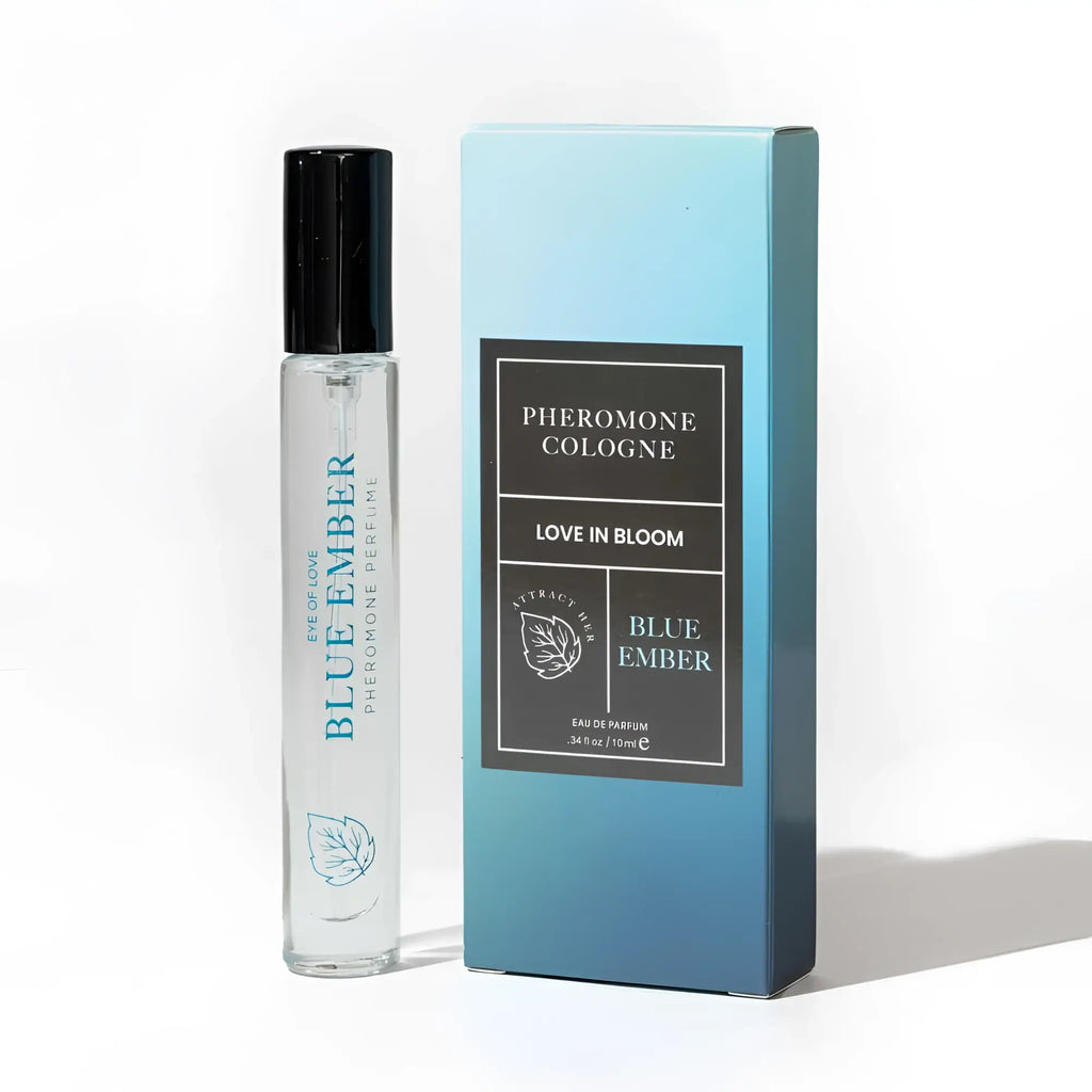 Clear glass rollerball perfume bottle with black cap and teal leaf logo labeled blue ember by pheromone cologne