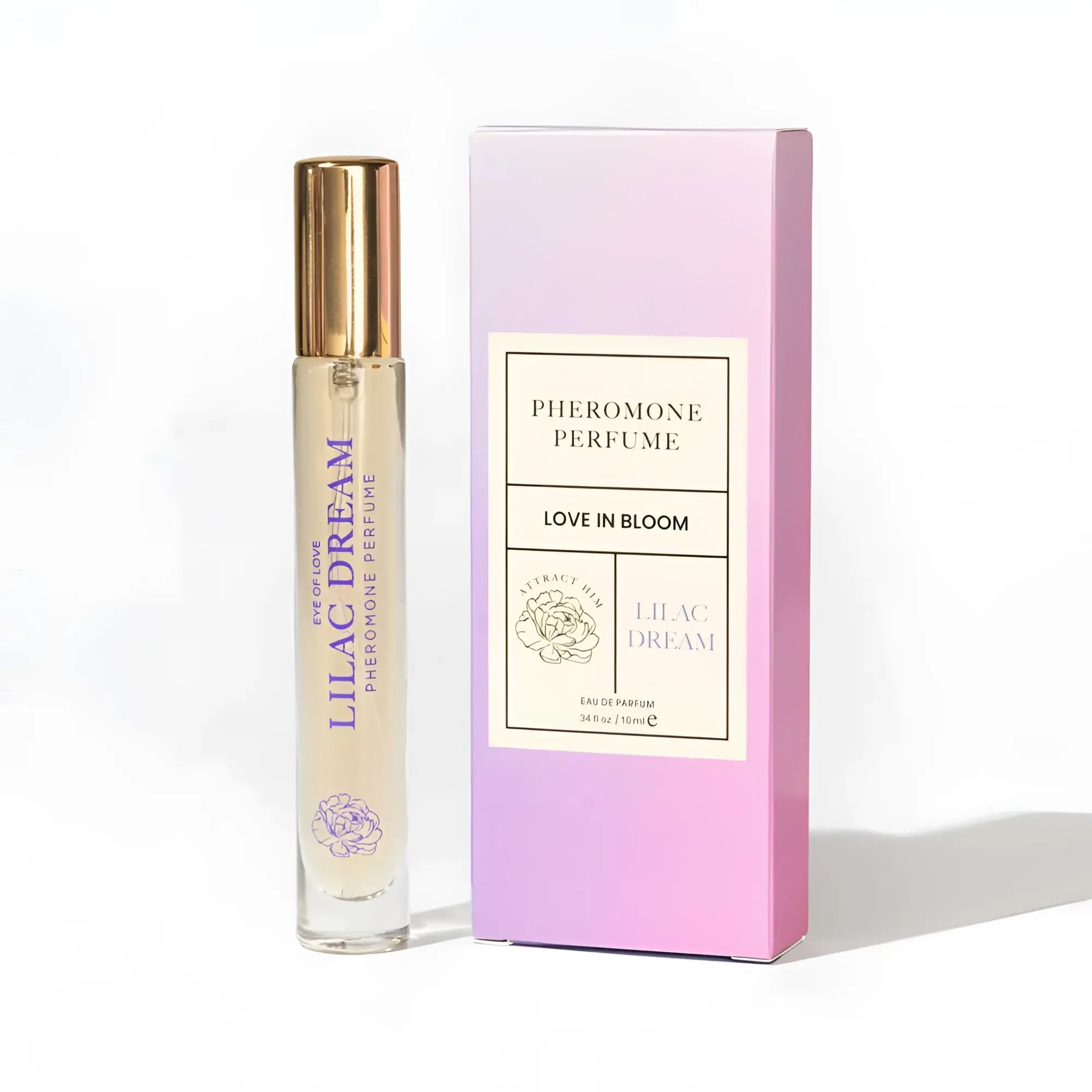 A slender glass rollerball perfume bottle with gold cap and purple floral design lilac dream by love in bloom
