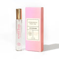 Sunny daze eye of love bloom pheromone perfume roll-on with clear glass bottle gold cap and pink floral label design