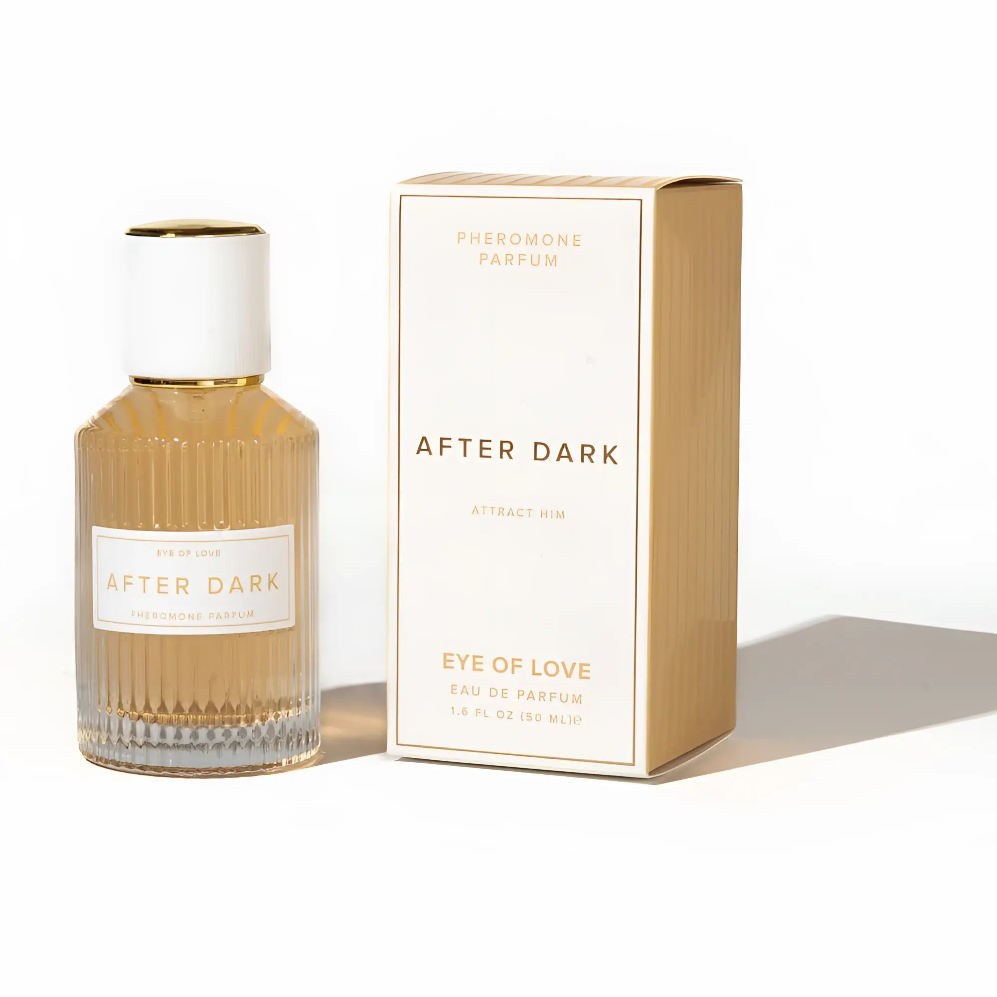 A golden hued ribbed glass bottle with white cap and gold accents beside its box for eye of love pheromone spray