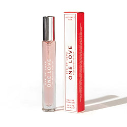 A sleek transparent glass rollerball perfume bottle with silver cap and pink liquid labelled eye of love pheromone parfum
