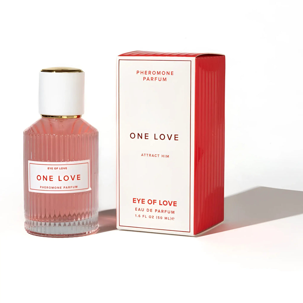 A pink ribbed glass perfume bottle with a white cap and gold accents for eye of love pheromone body spray 50ml