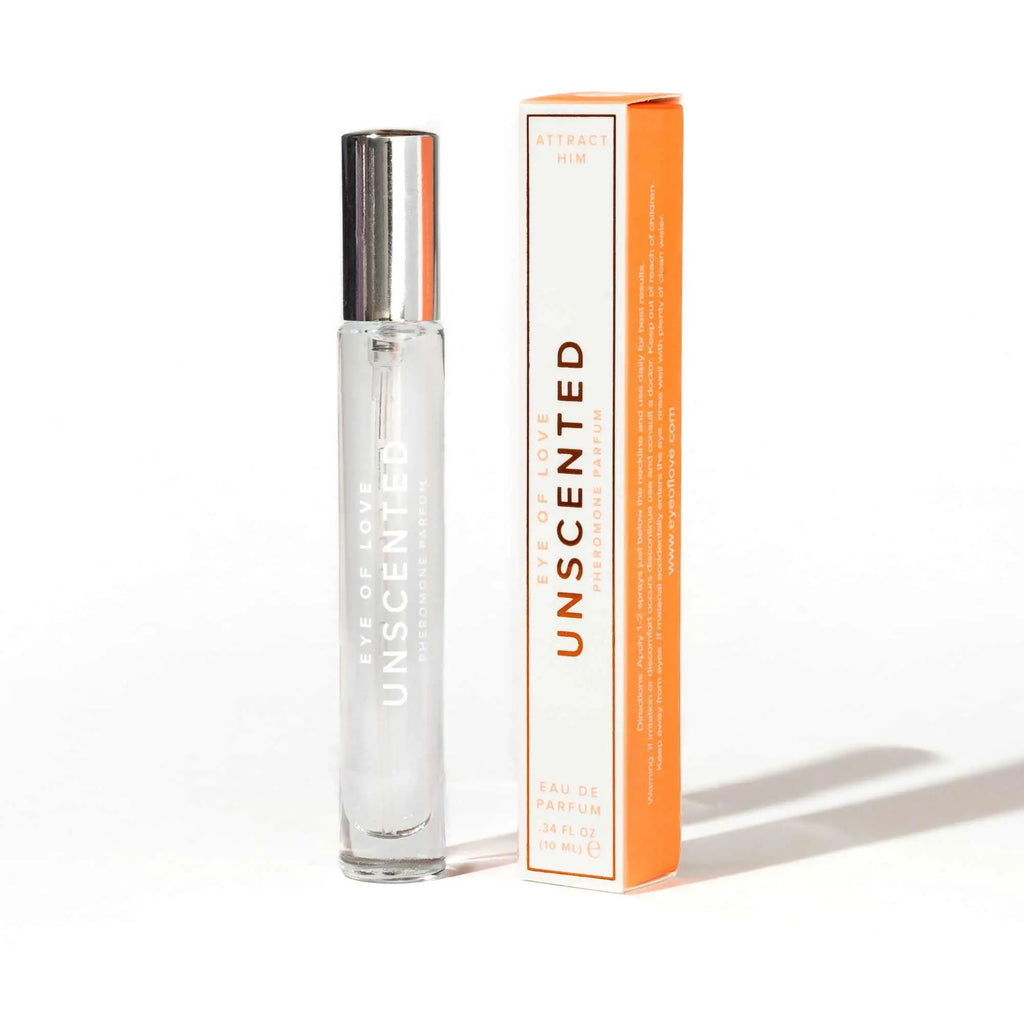 Clear glass rollerball perfume bottle with silver cap eye of love unscented beside orange cream packaging for 10ml pheromone spray