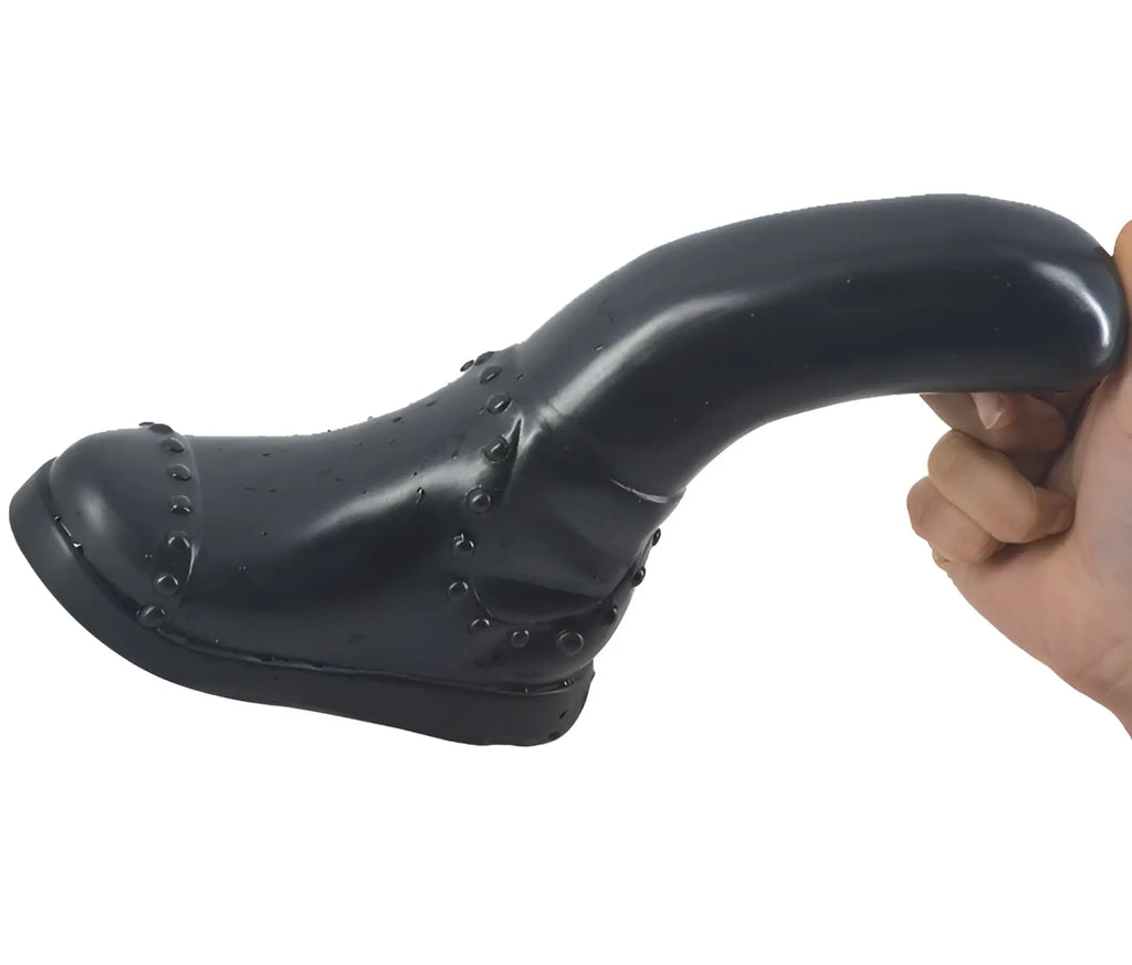 Black glossy FAAK boot dildo with studded detailing designed for intimate use