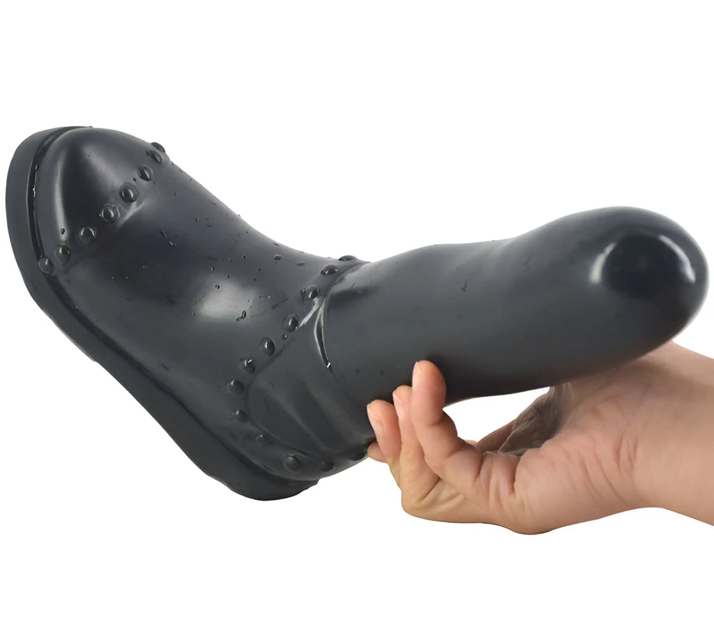 Faak boot dildo black with shiny surface and decorative studs along the toe area