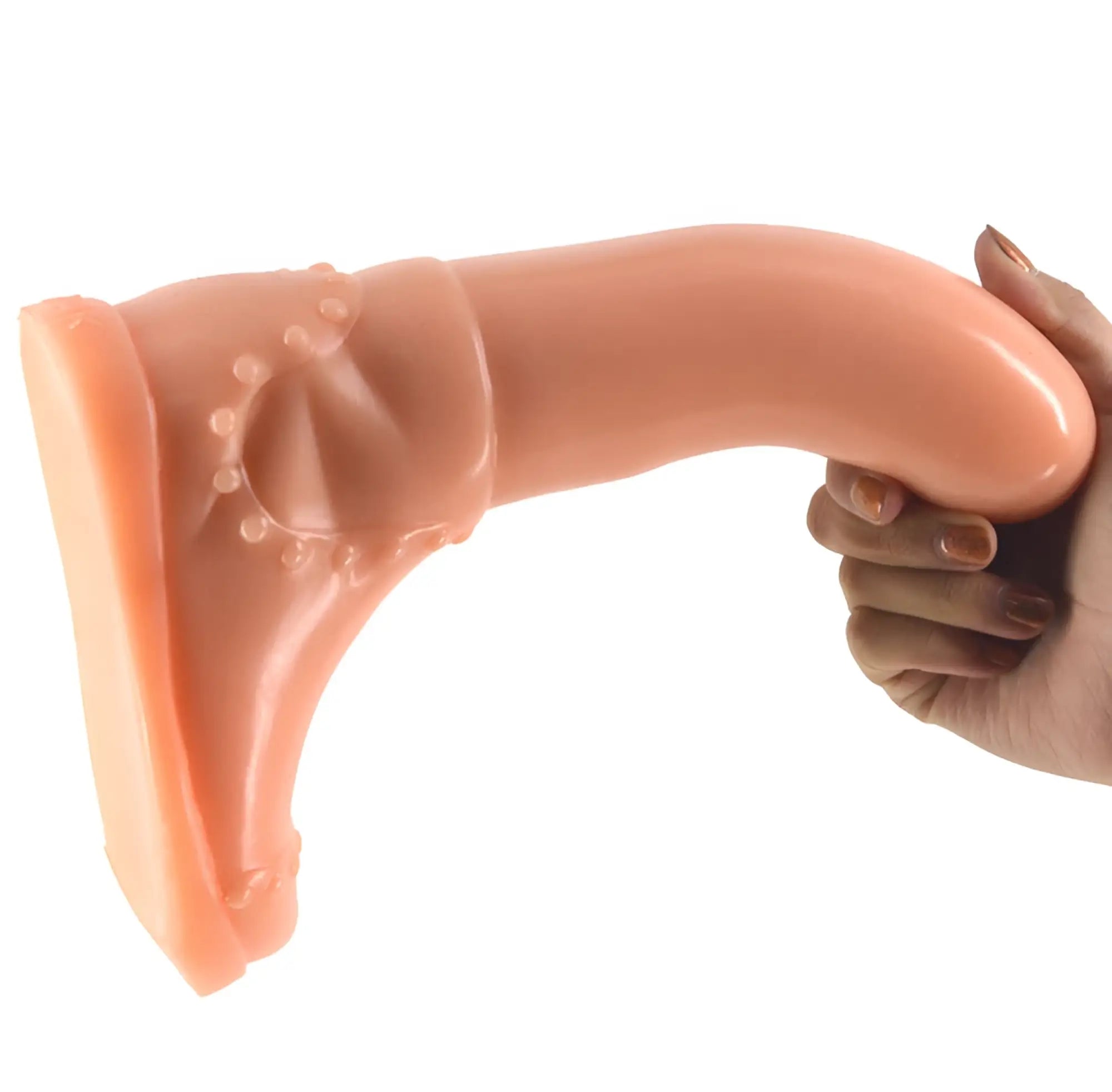 Peach-colored silicone FAAK Boot dildo with textured sunburst-patterned base for secure wear and stimulation