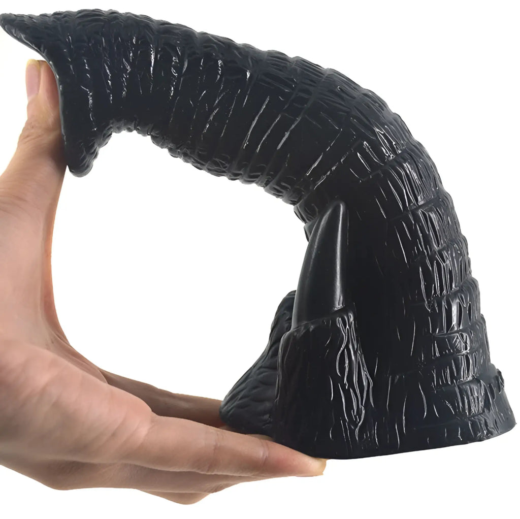 Faak elephant dildo black showing textured silicone horn with pointed tip and ridged surface for intimate use