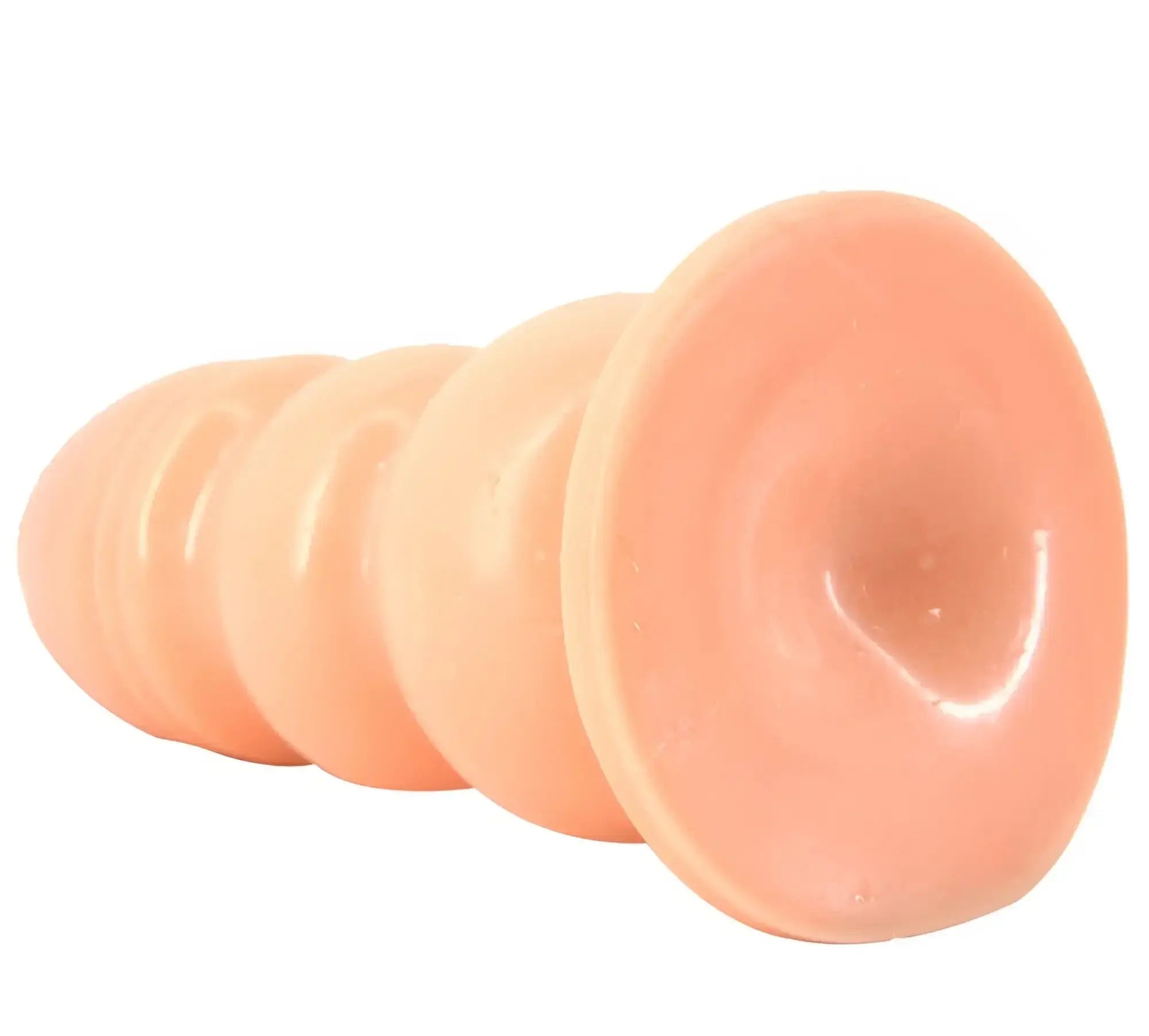 Peach-colored silicone suction cup anal plug with tapered segmented design from FAAK huge anal plug flesh