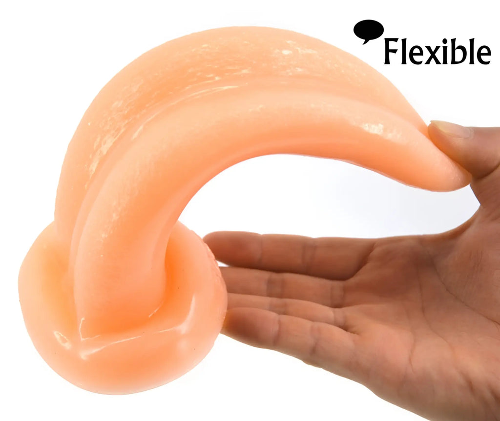 Peach-colored flexible FAAK tongue shape anal plug with a glossy finish made of flesh-like material