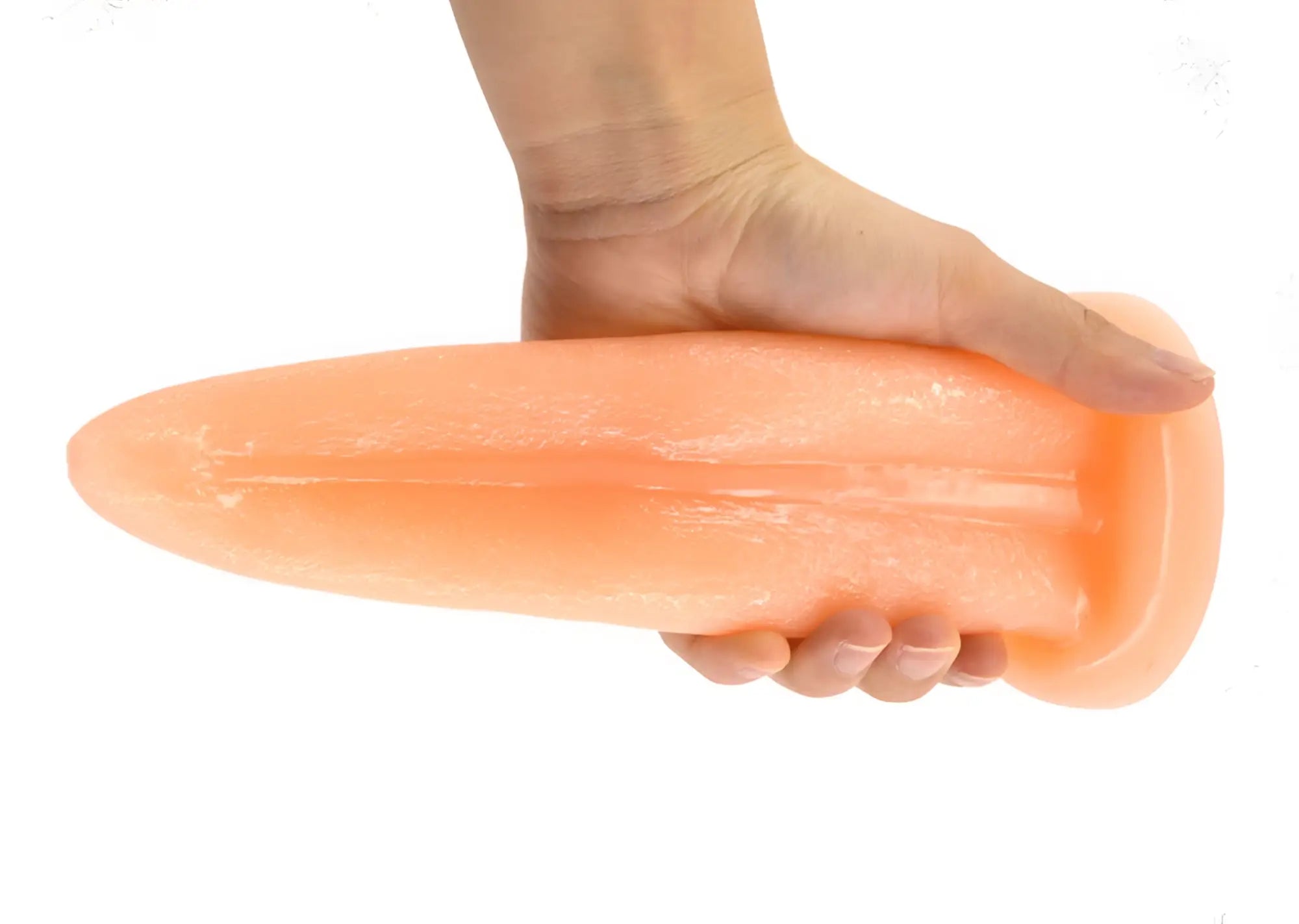 Peach-colored faak tongue shape anal plug made of smooth glossy silicone with tapered design for comfortable use