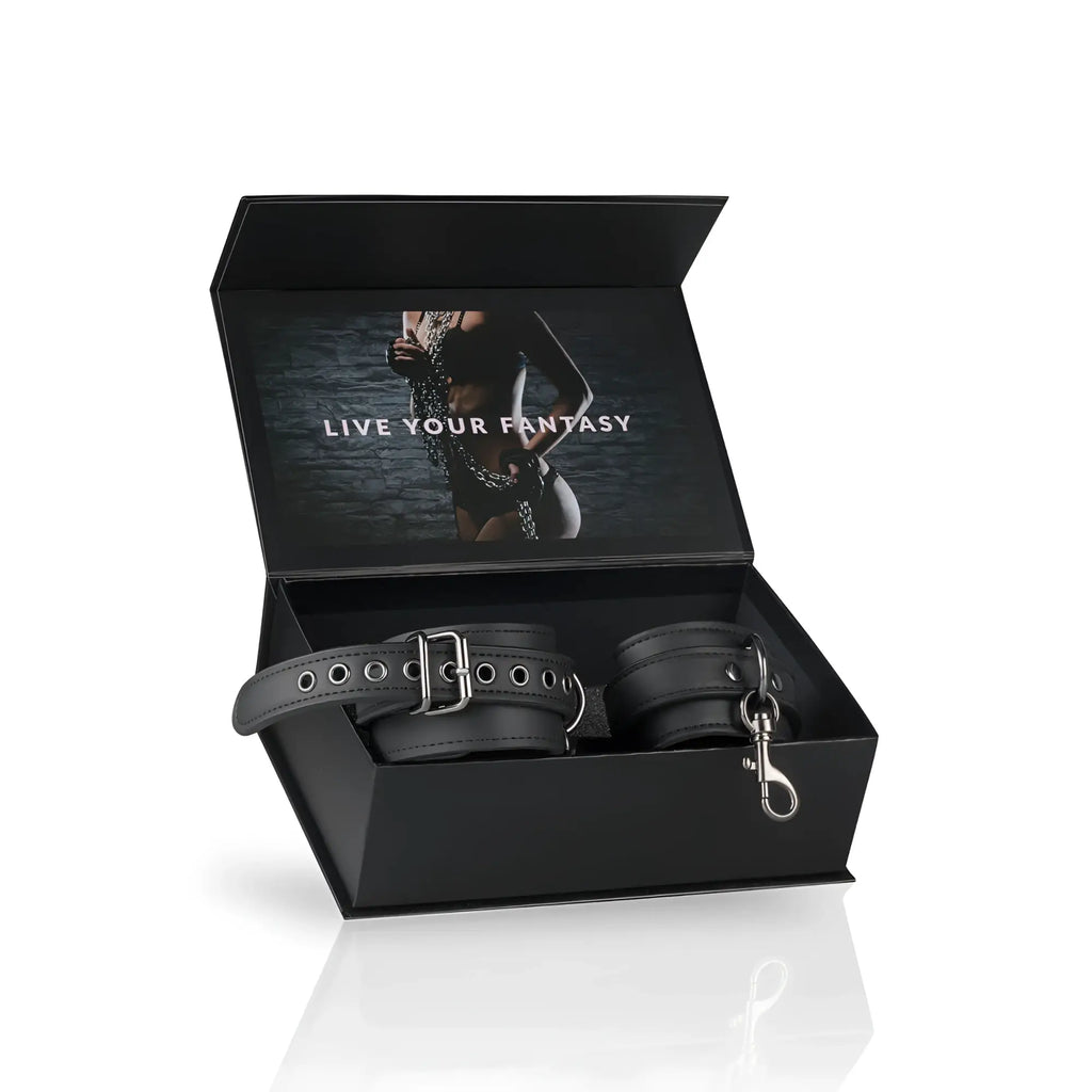 Black leather fetish collection ankle cuffs with silver metal hardware and matching leash for bondage use