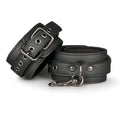 Black leather fetish collection ankle cuffs with silver metal buckles and studs for secure fit and style