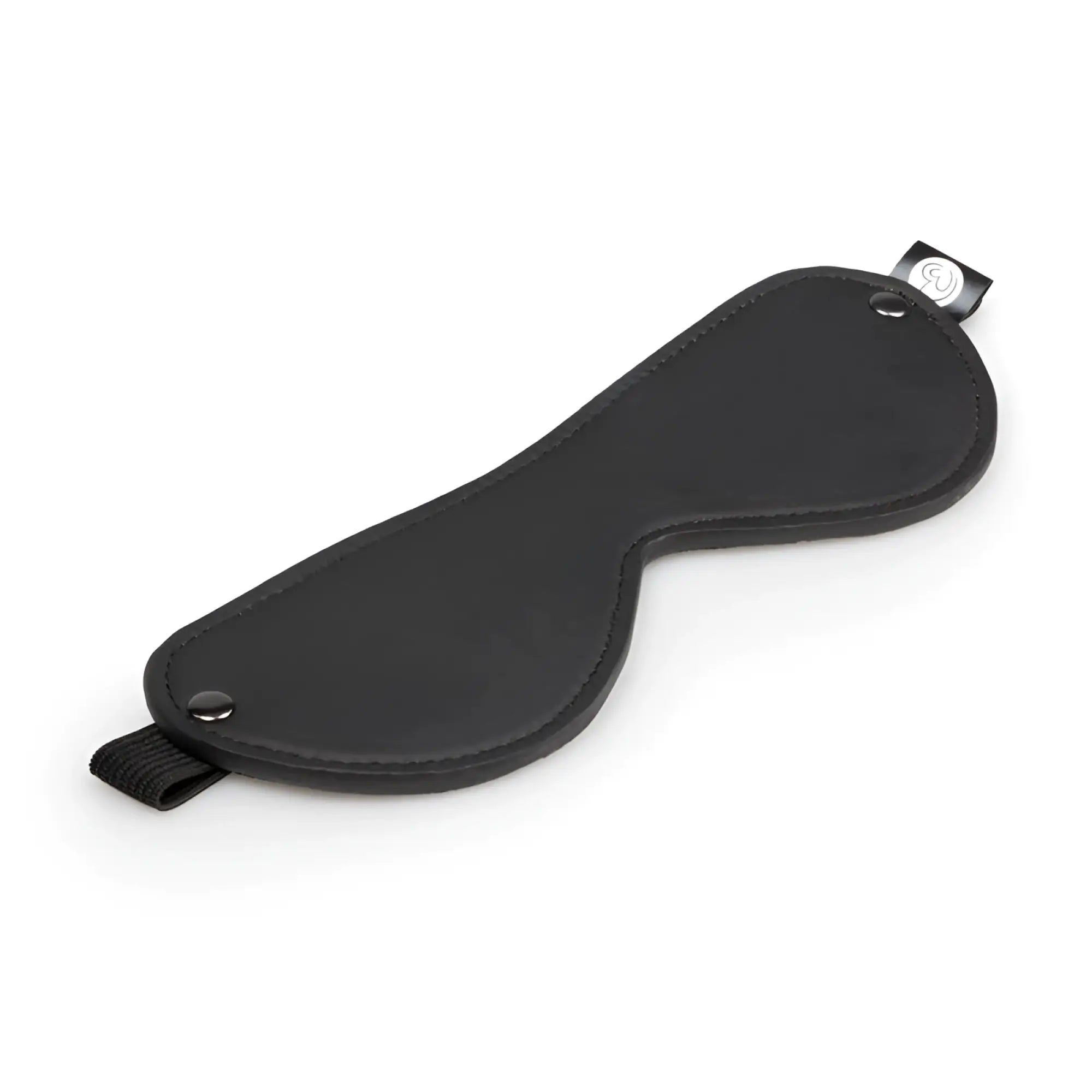 Black leather eye mask with adjustable straps and brand tag from fetish collection beginners bondage fantasy kit