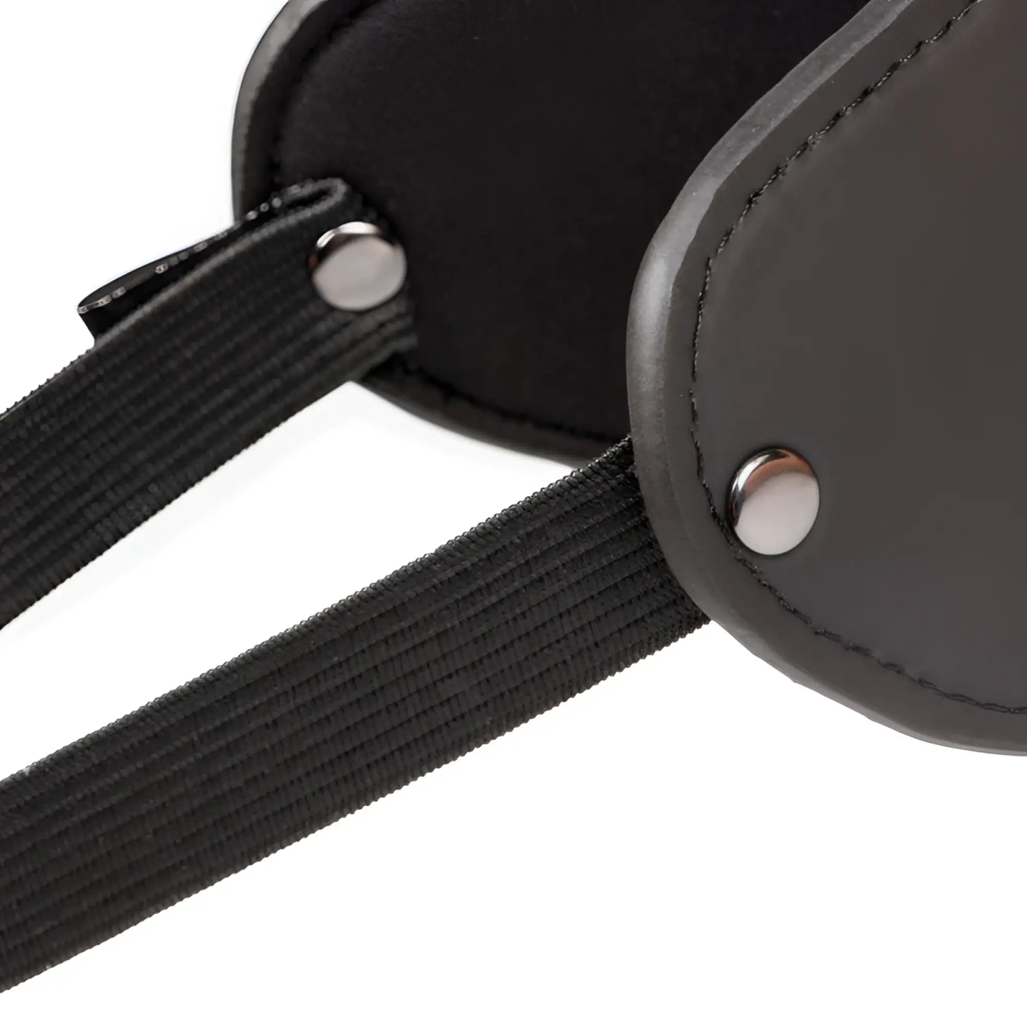 Black leather eye mask with elastic straps and silver metal rivets from the fetish collection beginners bondage fantasy kit