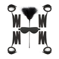 Black leather bondage kit featuring feather duster and blindfold from the fetish collection beginners bondage fantasy kit