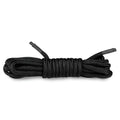 Black braided bondage rope 5m with reinforced ends neatly coiled from fetish collection for restraint use