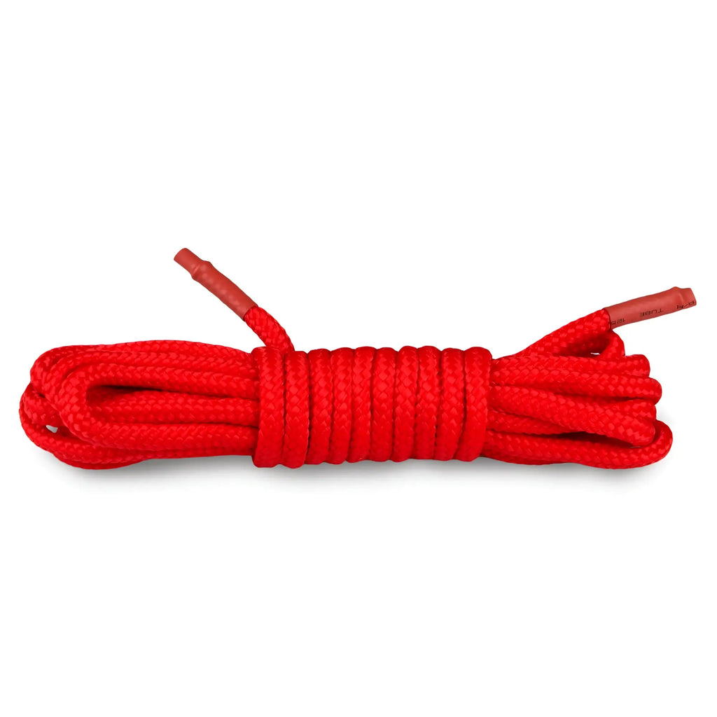 Bright red braided bondage rope 5m with reinforced ends coiled neatly from fetish collection