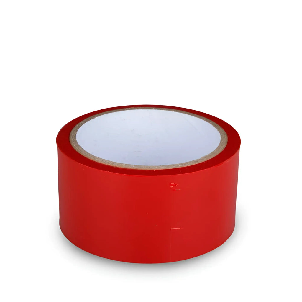 A roll of bright red fetish collection bondage tape with a white inner core and brown cardboard backing