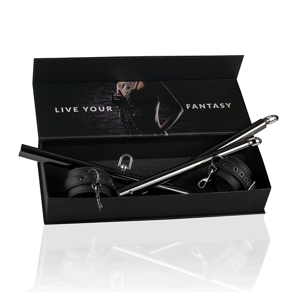 Black leather and metal bondage expander spreader bar and cuffs set in sleek black box from fetish collection
