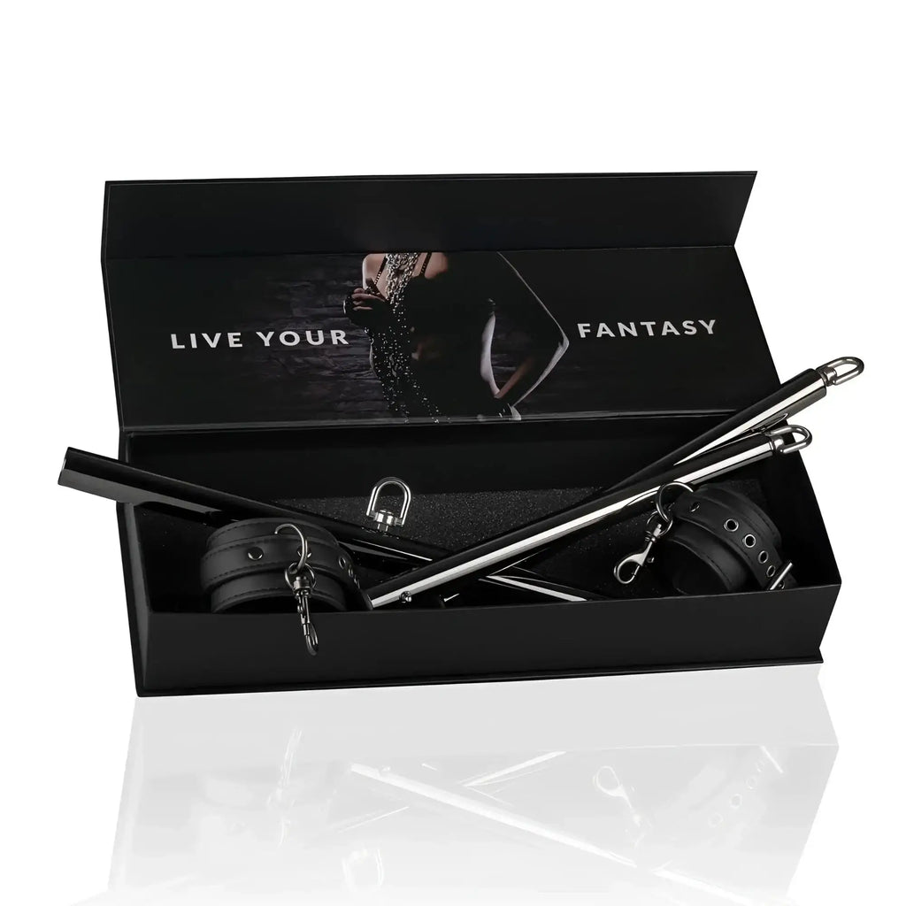 Black leather and metal bondage expander spreader bar and cuffs set in sleek black box from fetish collection